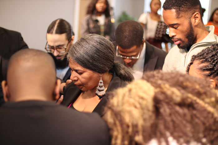 Members praying together